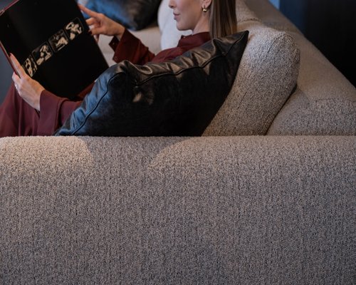 Reading a book on a comfortable sofa at night